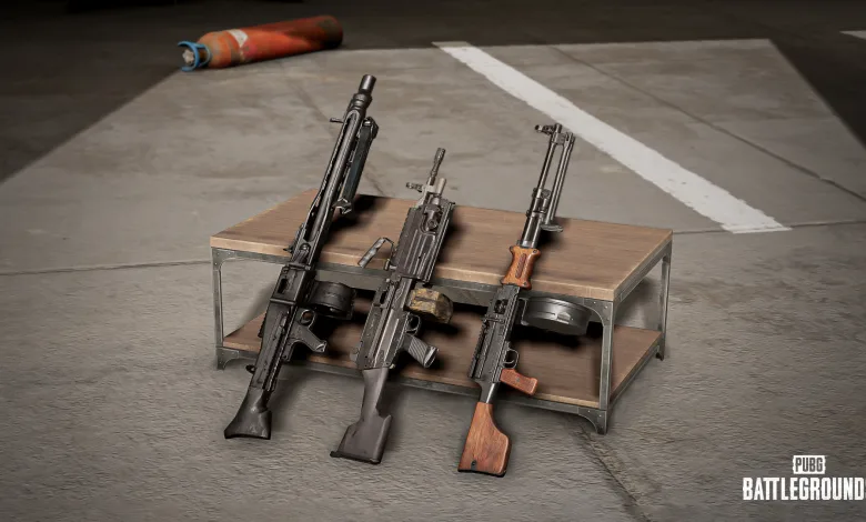 Three PUBG: BATTLEGROUNDS light machine guns displayed on a metal weapon rack.