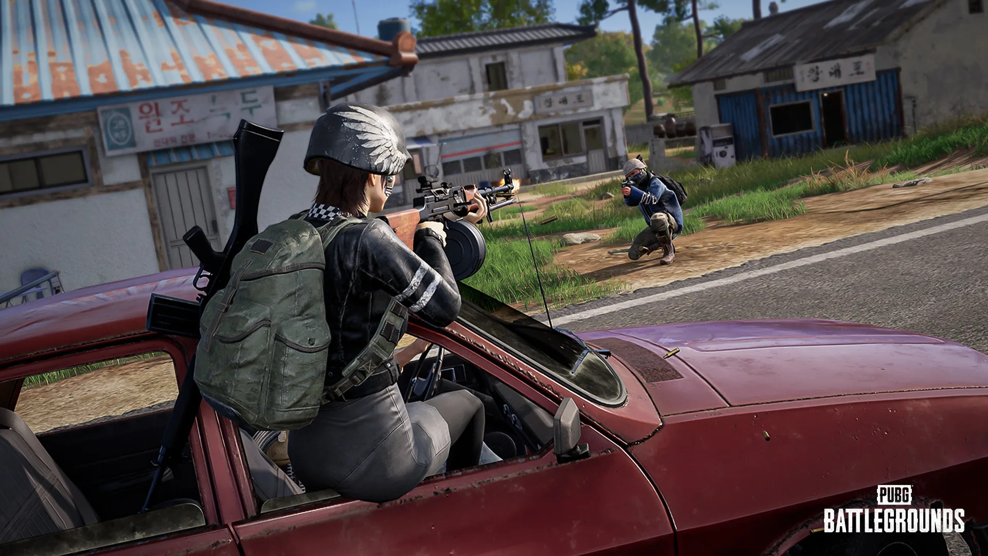 PUBG player firing from the roof of a moving car