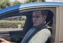 A Rideshare Stimulator character sits in the driver's seat of a blue car.