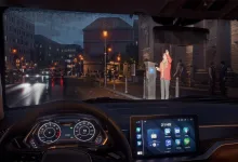 A driver views a rainy city street from inside a car in Rideshare Stimulator.