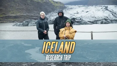 Three people stand in front of an Icelandic glacier beneath an Iceland Research Trip graphic.
