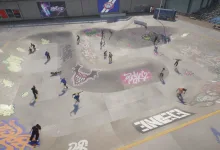 A large group of skate. players skating together in a graffiti-covered bowl area.