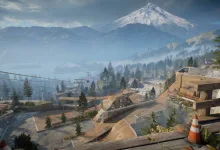 Mountain skate park with ramps and trails beneath a snowcapped peak