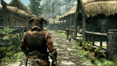 A helmeted Skyrim warrior stands on a village street surrounded by wooden buildings.