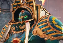 A Thousand Sons Sorcerer in ornate turquoise and gold Terminator armor