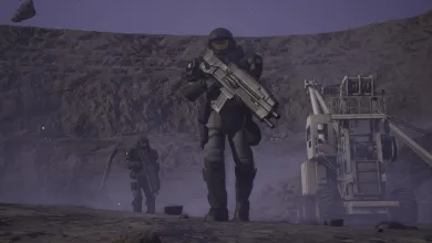 A Starship Troopers: Extermination trooper carrying a rifle walks across an industrial landscape, with another trooper and machinery in the background.