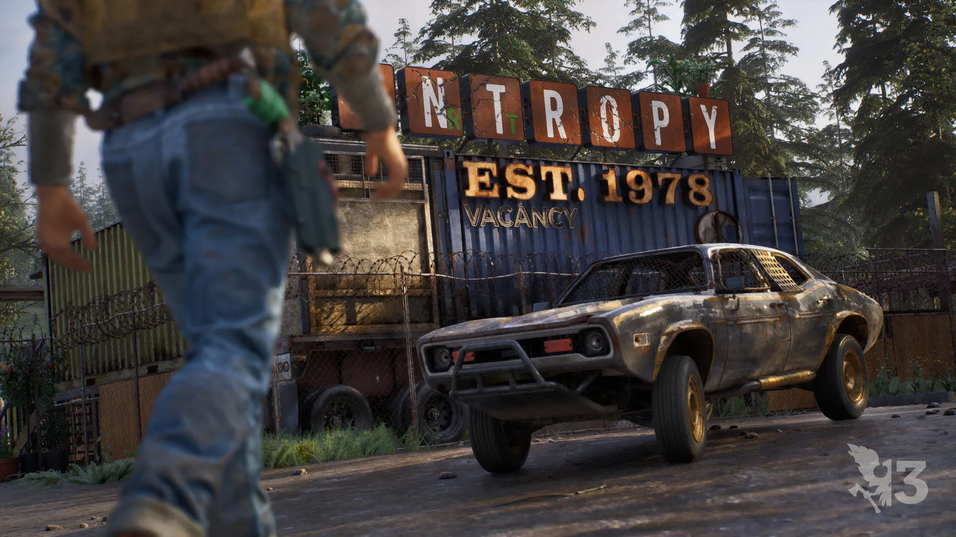 Survivor facing a damaged vehicle outside a roadside sign
