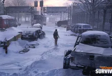 A Division 2 agent walks through a snow-covered Washington, D.C. street surrounded by abandoned vehicles.