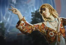 Contestant wearing a colorful floral outfit and sunglasses in THE FINALS