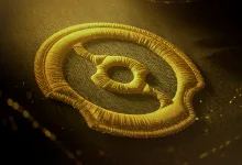 Gold Dota 2 The International emblem embroidered on dark fabric