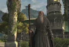 A bearded staff-wielding character stands among forested ruins in The Lord of the Rings: War in the North.