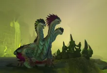 Three-headed creature standing in a green-lit World of Warcraft area