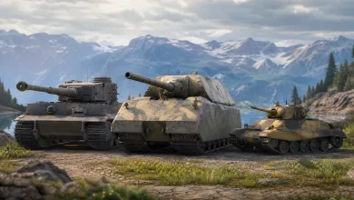 Three armored tanks lined up on a mountain road beside a lake and snow-covered peaks.