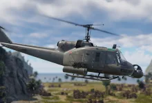 A UH-1C helicopter flies over a tropical landscape in War Thunder.