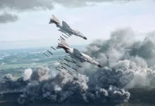 Two War Thunder fighter aircraft release weapons over a smoke-covered battlefield