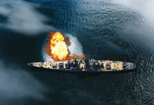 War Thunder battleship firing across the sea during a naval battle.