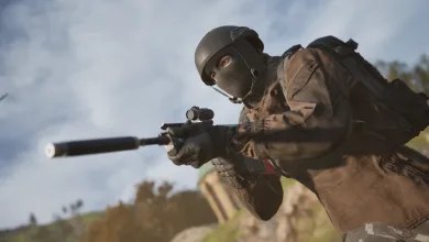 A masked WARDOGS soldier aims a suppressed rifle outdoors with a blurred industrial battlefield in the background.
