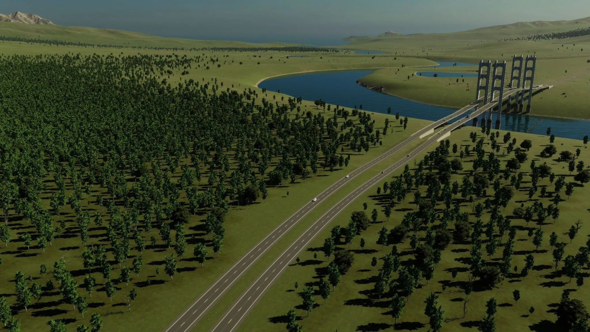 Waterway Pass with a highway crossing a river and forested terrain