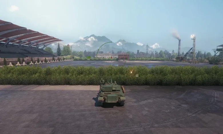A World of Tanks vehicle sits on a paved area beside a racetrack-like circuit with mountains in the background.