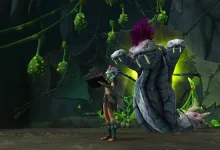 World of Warcraft character standing beside a large creature in a dark cavern