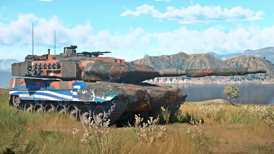 A War Thunder tank with blue, white, and brown camouflage beside a lake