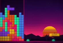 A colorful falling-block game screen shows stacked tetrominoes beside a Southern Border sign at sunset.