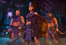 Three Conan Exiles Enhanced characters stand in a cavern, with the central warrior holding a large decorated shield.