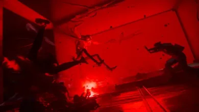 Hostile entities move through a red-lit room in Control Resonant.