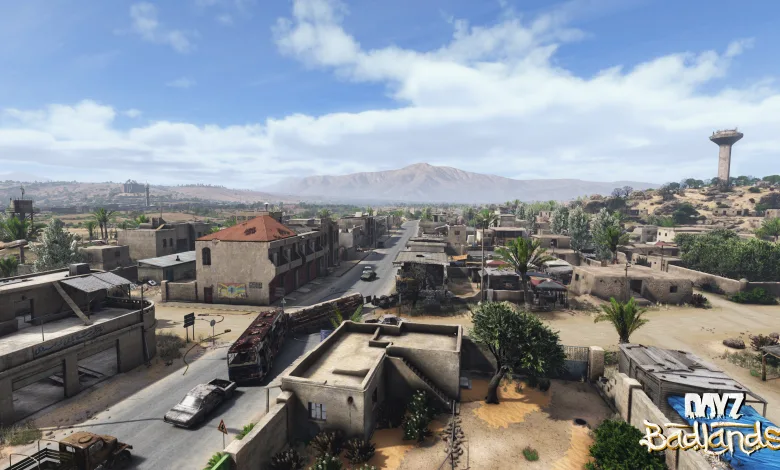 A wide view of Nasdara in DayZ Badlands shows a desert city, roads, and surrounding mountains.
