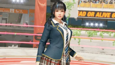 Minato stands in her school uniform inside a Dead or Alive 6 Last Round arena