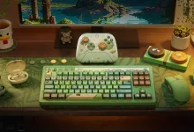 A Designed for Xbox Cozy Collection gaming setup displays a green keyboard, mouse, controller, and woodland-themed decor.