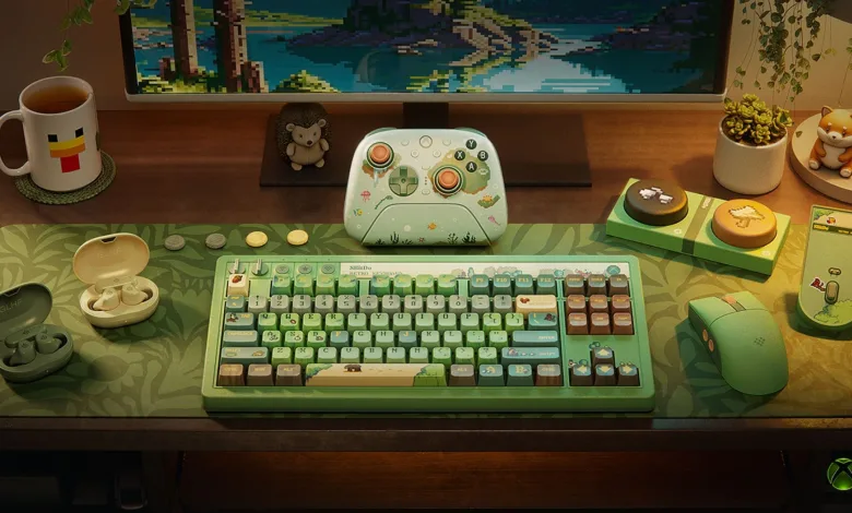 A Designed for Xbox Cozy Collection gaming setup displays a green keyboard, mouse, controller, and woodland-themed decor.