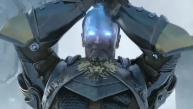 A blue-faced armored demon looms in a scene from Dragon Age: Origins