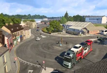A Euro Truck Simulator 2 truck navigates a roundabout among buildings in Cavan.