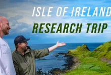 Two SCS On The Road team members stand beside the Irish coast during the Isle of Ireland research trip.