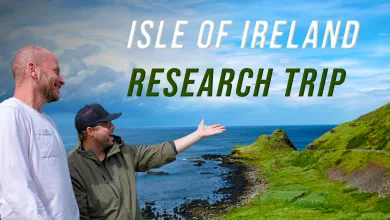Two SCS On The Road team members stand beside the Irish coast during the Isle of Ireland research trip.