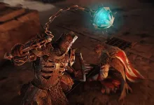 Xaphan swings a chained flail with a glowing blue head at Hulda during their fight in For Honor