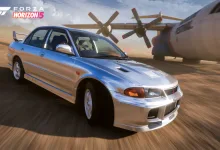 A silver 1995 Mitsubishi Lancer Evolution III driving through a dusty desert area in Forza Horizon 5