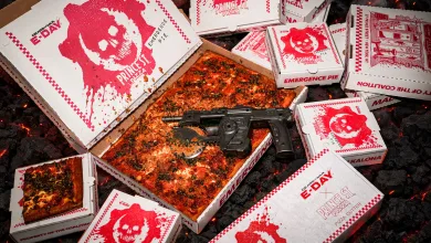 A square pizza surrounded by Prince St. Pizza boxes and a Prototype Lancer-style pizza cutter