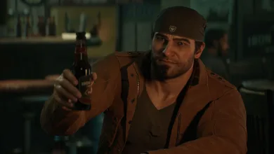 A bearded Gears of War: E-Day character in a cap and brown jacket raises a bottle in a dim bar.