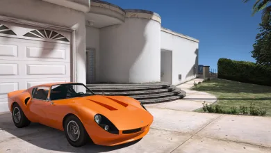 An orange sports car sits outside a white modern house in Grand Theft Auto V.