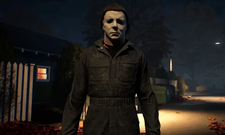 Michael Myers stands on a dark residential street at night in Halloween: The Game.