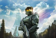 An armored Spartan soldier stands in a futuristic landscape associated with the next Halo game.