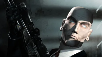 Agent 47 from Hitman: Codename 47 holds a rifle in a close-up portrait