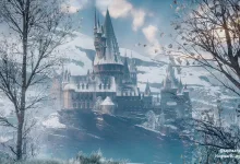 A snow-covered Hogwarts castle rises between bare trees under a pale blue sky in a winter photo-mode scene.