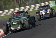 Two Caterham race cars drive through a circuit during an iRacing race.
