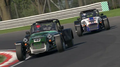 Two Caterham race cars drive through a circuit during an iRacing race.