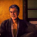 Kiyoshi Otsuru seated in a traditional room