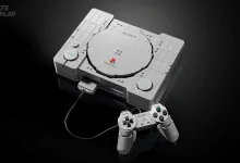 A LEGO replica of the original PlayStation console with its wired controller on a dark background.