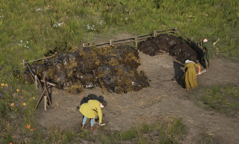 Workers tend a field beside a large dung pile in Manor Lords
